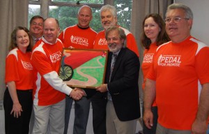 FPC's Pedal For Promise 2013 team (L-R):  Debra Califf, Paul Califf, Brian Archibald (holding picture), Ed Haversang, Rich Heun, Jim Cummings (holding picture), Diane Van Leer, Rey Mercado.  Cyclists who participated but not pictured:  Duane and Ann Jacobsen.
